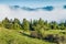 Foggy summer scene of Triglav national park, Bohinj lake location. Sunny morning view of Julian Alps, Slovenia, Europe. Beauty of