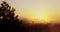 Foggy sunrise view from high mountain hills. Sun, sky and clouds over horizon, 4k video