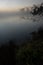 Foggy sunrise at water pond at the mountain top of Phu Kradueng National Park