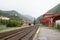 Foggy view on Breil-sur-Roya - railway station and mountains surround in Provence-Alpes, department of France