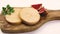 Foie gras on a cutting board isolated hard a white background