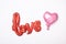 Foil balloon shape heart and love word on white background. Decorations for Valentines or Wedding Day