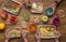 Foil boxes, fruits, nuts and vegetables on wooden table