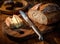 Foil wrapped processed cream cheese, table knife and slice of bread on a cutting board over blue wooden table. Small