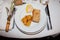 Fois gras apple and bread in white plate restaurant
