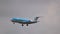 Fokker 70 of KLM airlines descend before landing