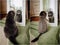 A fold-eared adult Scottish cat poses at the mirror, collage diptych before and after a haircut