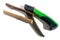 Foldable compact hand-held toothed garden saw for pruning plants, branches.