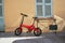 Foldable electric bike in a smaal town at the front door