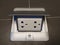 Foldable shinny metal cover with white double electric power Socket with 3 channel builted on ceramic floor, backgrounds