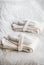 Folded bathrobes and Slippers on the bed