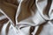 Folded beige viscose and polyester fabric