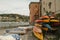 Folded boats in the bay of the Silence in Sestri Levante, Liguria, Italy across the colorful houses, mountains, and coastline
