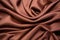 folded brown silk fabric with rich texture