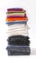 Folded colorful clothes in stack. Home organizing. Domestic storage