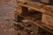 Folded empty wooden pallets in the street