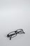 Folded fashion reading glasses for woman or unisex on white background.