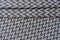 Folded grey fabric with zig zag pattern