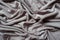 Folded grey viscose fabric from above