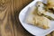 Folded pancake in a plate on a wooden background malaysian delicacies