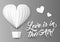 Folded paper balloon and hearts with sign Love is in the Air on transparency grid background