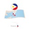 Folded paper map of Philippines with flag pin of Philippines