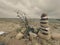 Folded pebbles pyramid. Rounded pebble stones on the sea beach