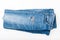 Folded ripped blue jeans on white background. Top view. Fashion