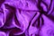 Folded simple bright violet linen fabric