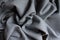 Folded simple unprinted dark gray viscose fabric