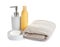 Folded soft towel and toiletries on white