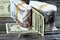 Folded stack Egypt money banknote bills of 100 and 50 EGP LE one hundred Egyptian and fifty Pounds on USA American dollars
