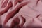 Folded thin pastel pink chiffon fabric
