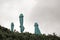 FOLDED TURQUOISE PARASOLS AGAINST THE SKY