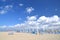 Folded umbrellas and chairs on beautiful beach Marina di Vecchiano nearby Pisa in Italy