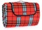 Folded up travel, picnic blanket grille with red, blue, black.