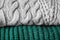 Folded warm sweaters as background, closeup