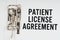 In the folder under a paper clip there is a white sheet with the inscription - Patient license agreement