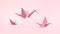 Folding birds Paper and peace on Pastel Pink Background