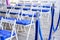 Folding chairs made of white resin with blue cushions designed for the event