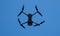 Folding drone taking aerial images from the blue sky