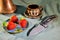 Folding knife stainless steel sharp blade aluminum gray handle red fresh strawberry close up still life background
