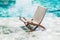 Folding rattan chair chaise longue by the pool. Clear transparent water