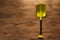 Folding small yellow shovel lying on wooden floor