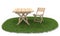 Folding table and chair on green grass