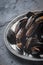 Folds mussels on an old metal plate on a slate