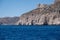 Folegandros island, Vorina bay, Cyclades, Greece. High cliff, Aegean ripple sea, clear blue sky