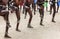 Folk dance on the sand. Feet of dancing Africans on a sandy surface