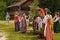 Folk festival dedicated to the Holy Trinity at the Museum of wooden architecture of Vitoslavlitsa. Girls in traditional sundresses