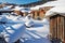 The folk houses in white snow and blue sky